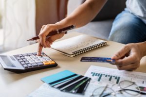 young woman checking bills taxes bank account ba 2021 10 06 09 53 02 utc